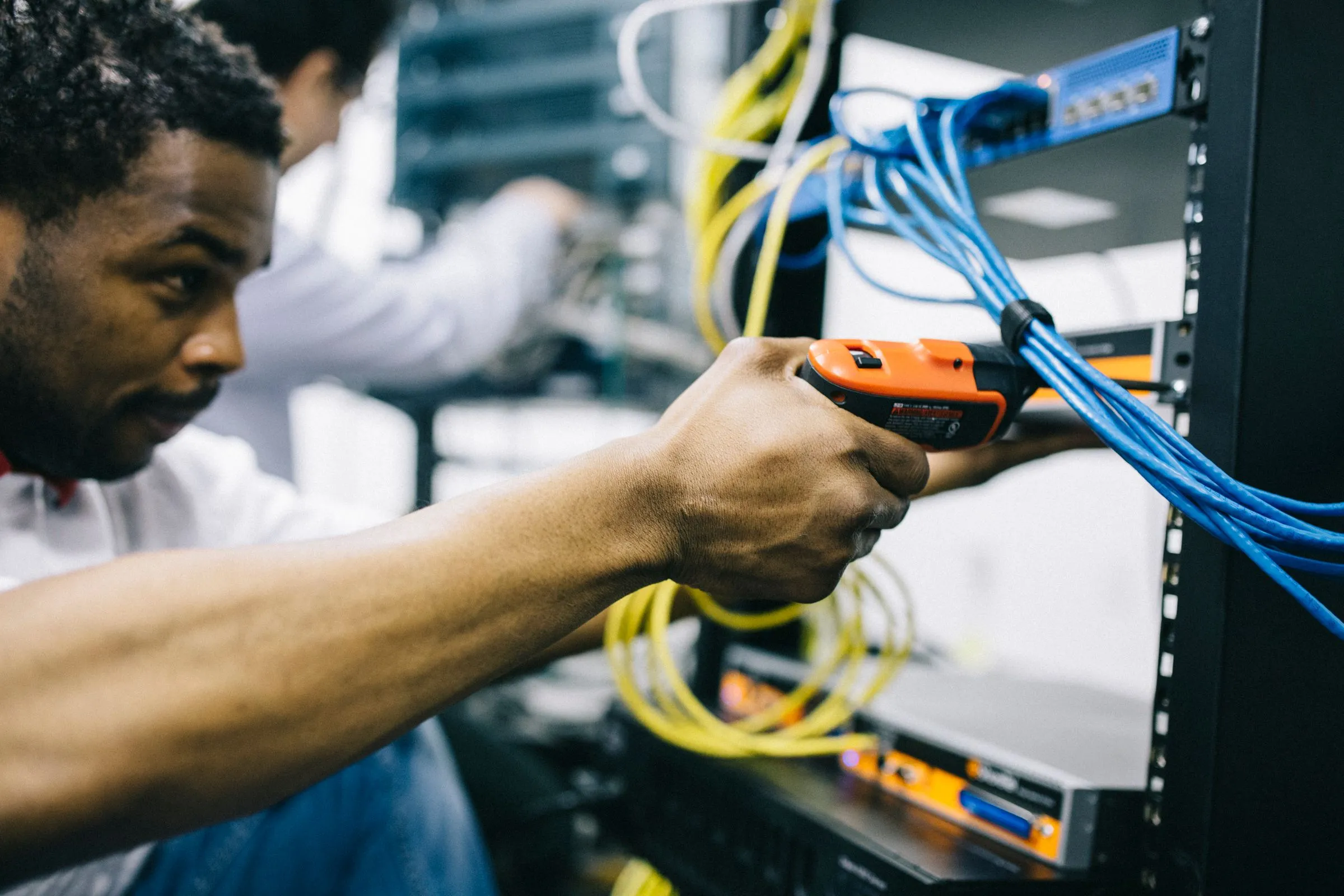 Hands mounting equipment in a network rack